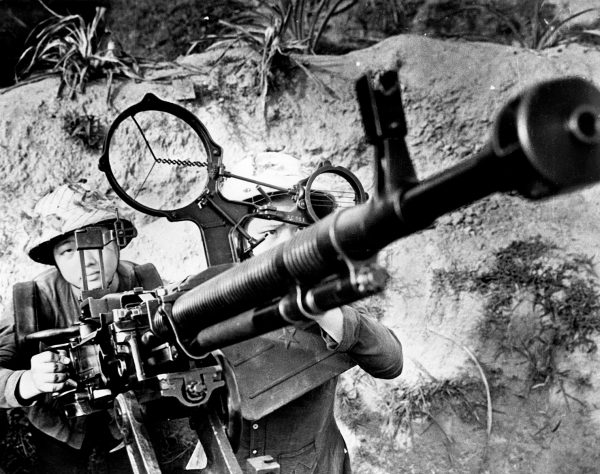 Women of the North Vietnamese Army aiming an anti-aircraft gun in a propaganda photograph during the Vietnam War. (Photo by Central Press/Getty Images)